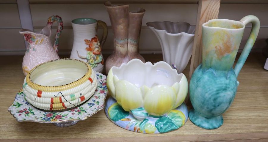 A group of post-war Clarice Cliff including a My Garden vase and jug, Water Lily bowl, 21cm wide, Celtic Harvest jug and two 1930s jugs